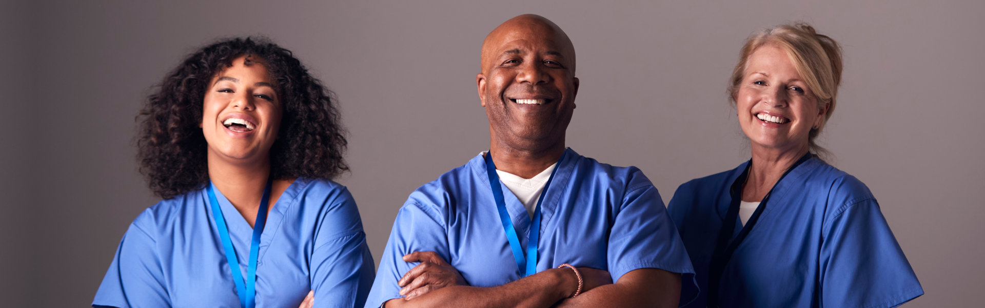 three caregivers smilng